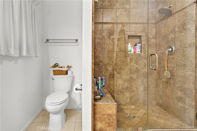 bathroom with a shower with door, tile patterned floors, and toilet