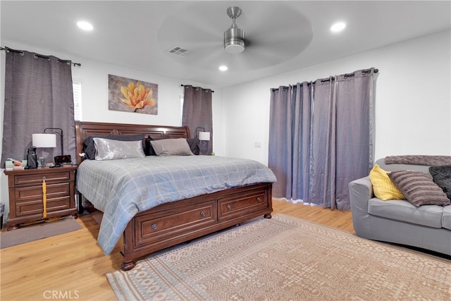 bedroom featuring light hardwood / wood-style flooring and ceiling fan