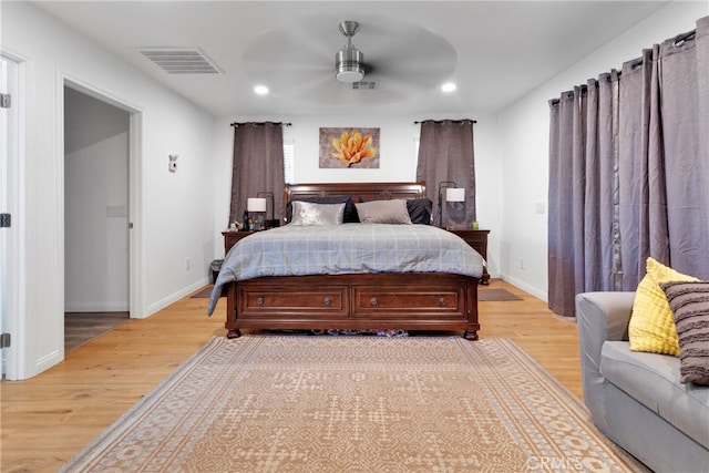 bedroom featuring ceiling fan and light hardwood / wood-style floors