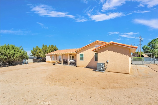 rear view of property featuring cooling unit