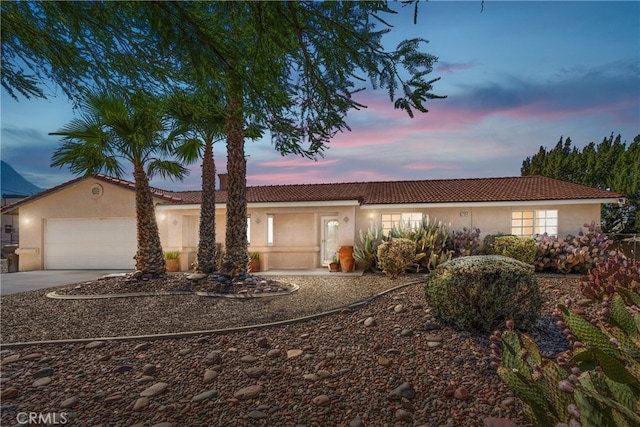 ranch-style house featuring a garage