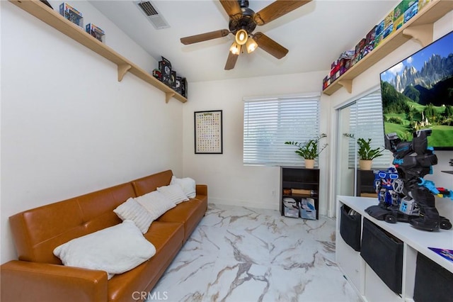 living area featuring ceiling fan