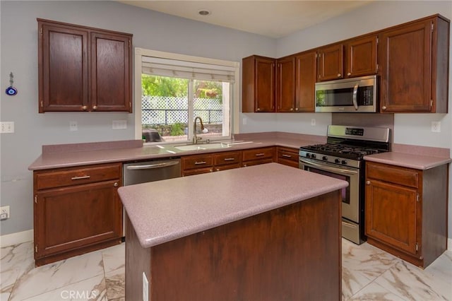 kitchen with sink, a center island, and stainless steel appliances