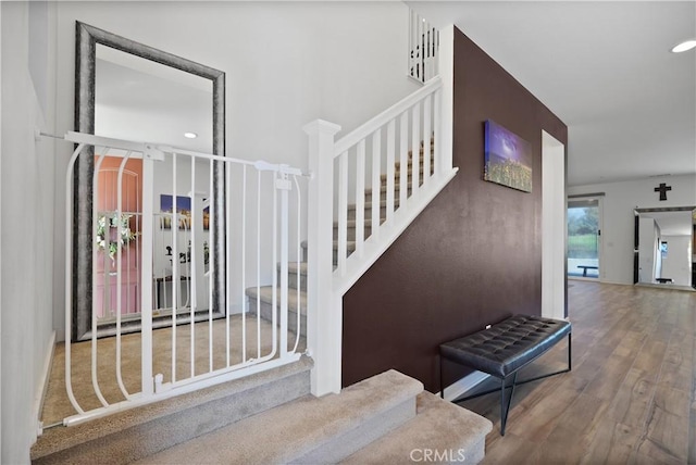 staircase featuring hardwood / wood-style flooring