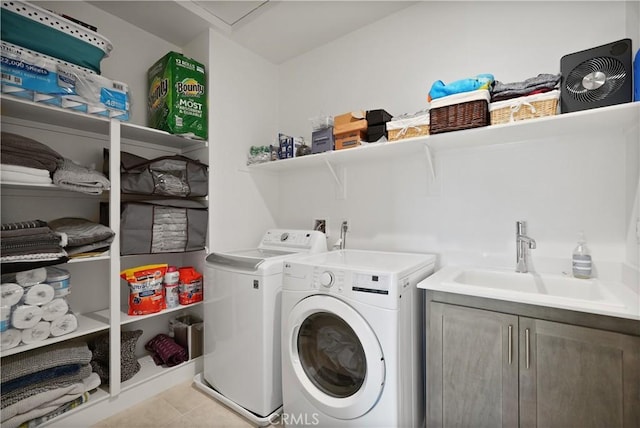 washroom with sink and washing machine and dryer