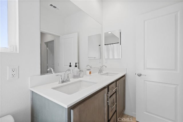 bathroom with vanity and tile patterned flooring