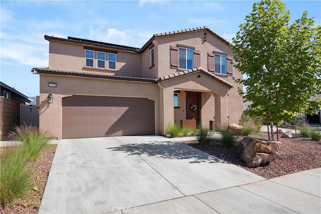 mediterranean / spanish-style home with a garage