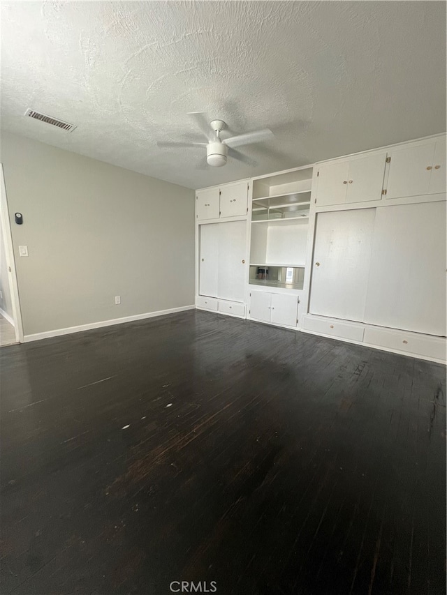 2202 Bedford Way, Bakersfield, CA 93308 - unfurnished living room with dark hardwood / wood-style floors, a textured ceiling, and ceiling fan