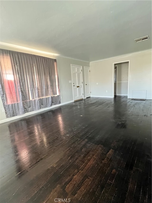 spare room featuring dark hardwood / wood-style floors