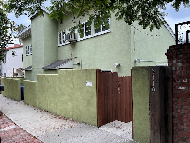 view of side of property with cooling unit