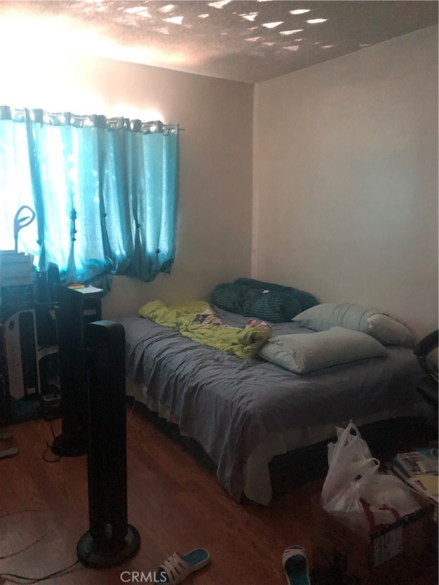 bedroom featuring wood-type flooring