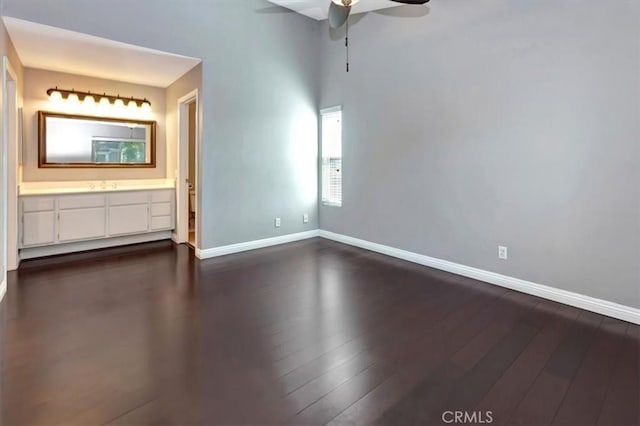23556 Cambridge Rd Unit 327, Yorba Linda, CA 92887 - unfurnished bedroom featuring connected bathroom, baseboards, and dark wood finished floors