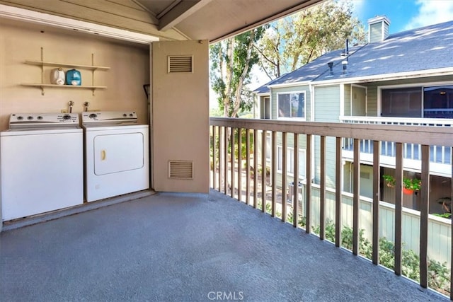 balcony featuring independent washer and dryer