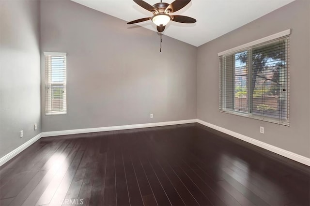 unfurnished room with ceiling fan, vaulted ceiling, and wood-type flooring