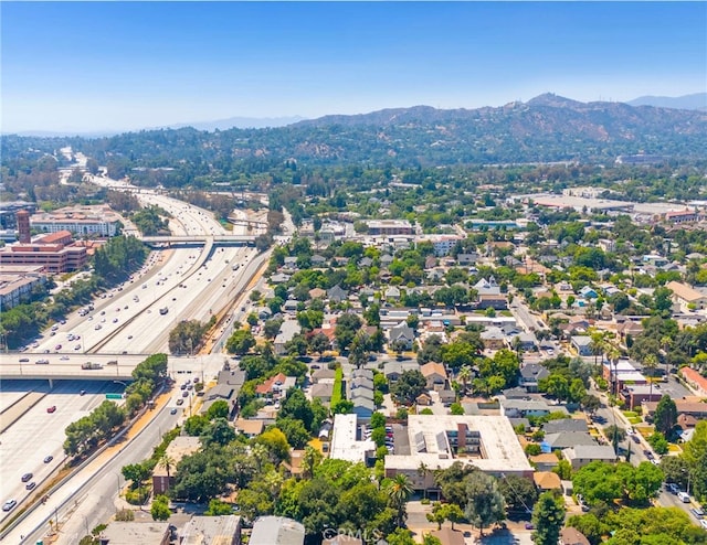 birds eye view of property with a mountain view