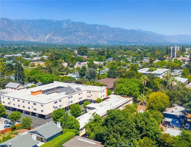 birds eye view of property with a mountain view