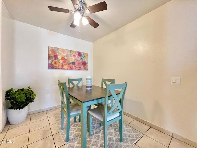 dining area featuring ceiling fan and light tile patterned floors