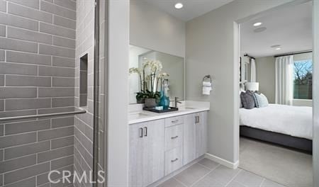 bathroom featuring tile patterned flooring and vanity