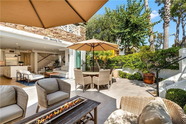 view of patio / terrace with a fire pit