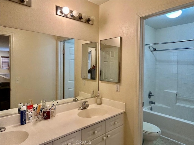 full bathroom with shower / tub combination, tile patterned floors, vanity, and toilet