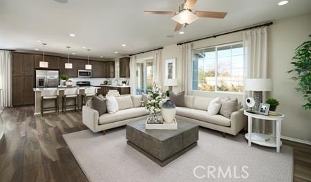 living room with ceiling fan and hardwood / wood-style flooring