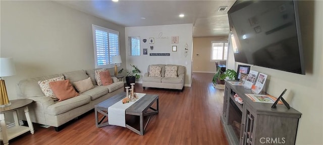 living room featuring dark wood-type flooring