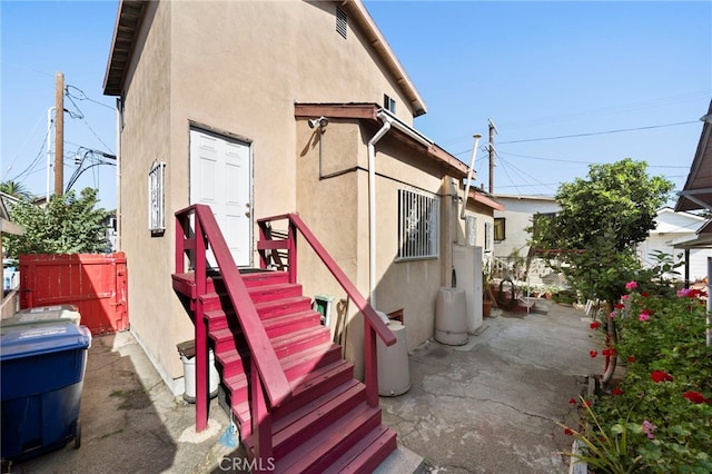 view of property exterior with a patio area