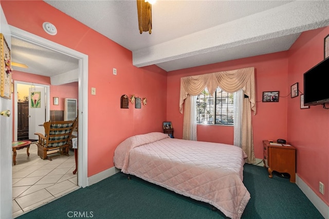 carpeted bedroom with a textured ceiling