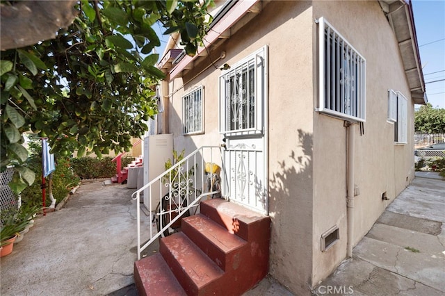 view of property exterior featuring a patio area