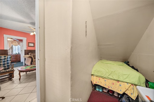 bedroom featuring ceiling fan and light tile patterned floors