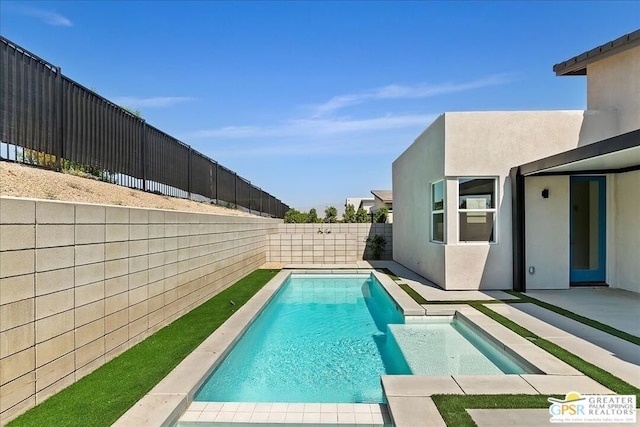 view of pool featuring a patio