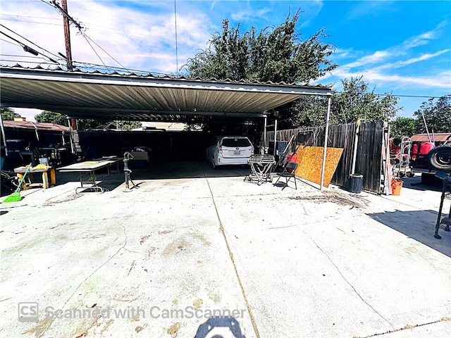 view of vehicle parking featuring a carport