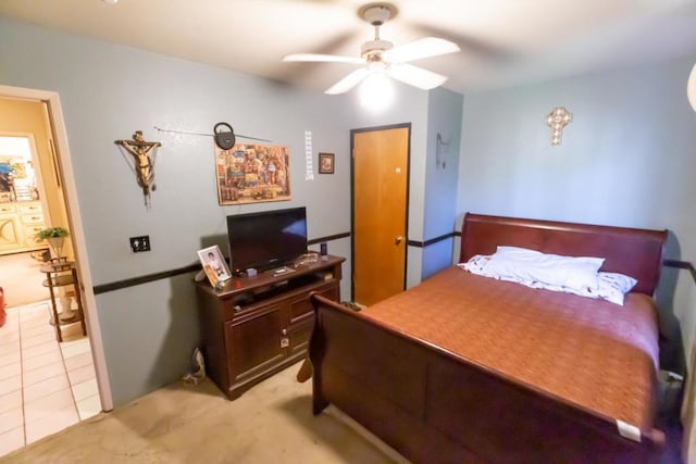 bedroom featuring light tile patterned flooring and ceiling fan