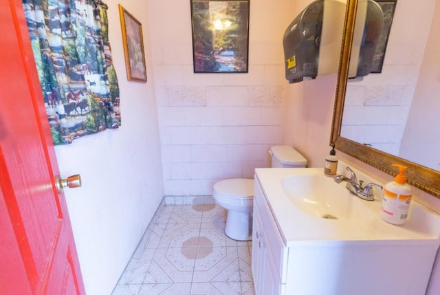 bathroom with vanity, toilet, and tile patterned floors