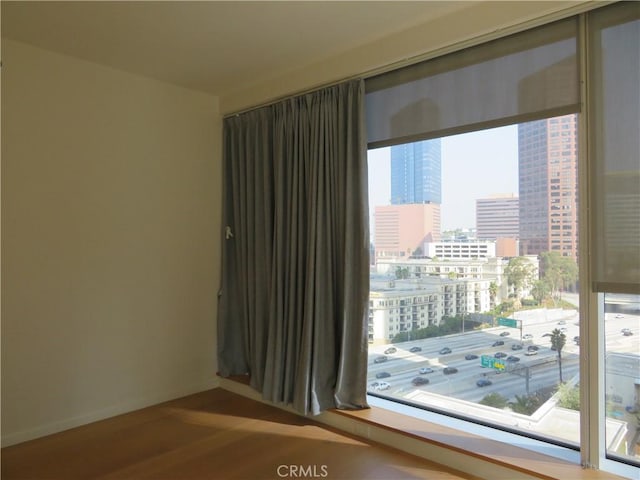 889 Francisco St Unit 1609, Los Angeles, CA 90017 - empty room with a city view, wood finished floors, and baseboards