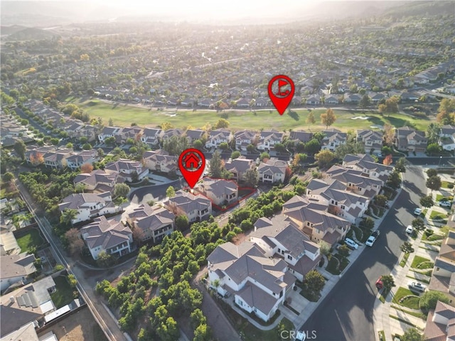 birds eye view of property with a residential view