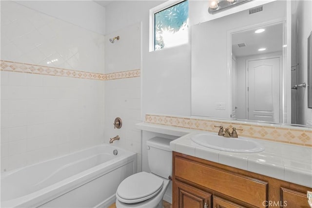 full bathroom with toilet, washtub / shower combination, visible vents, and vanity