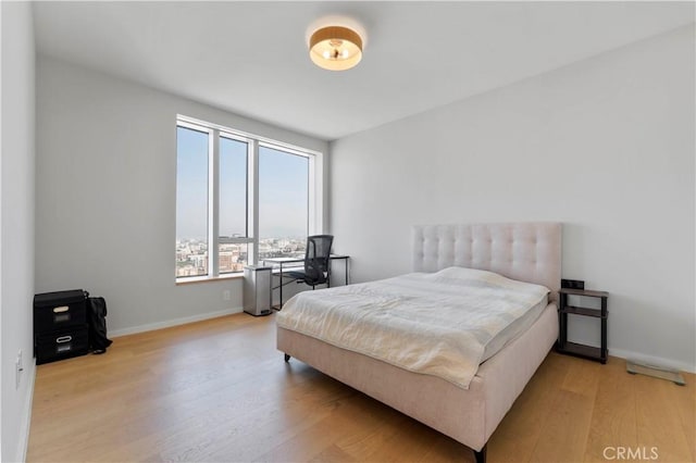 bedroom with light hardwood / wood-style floors