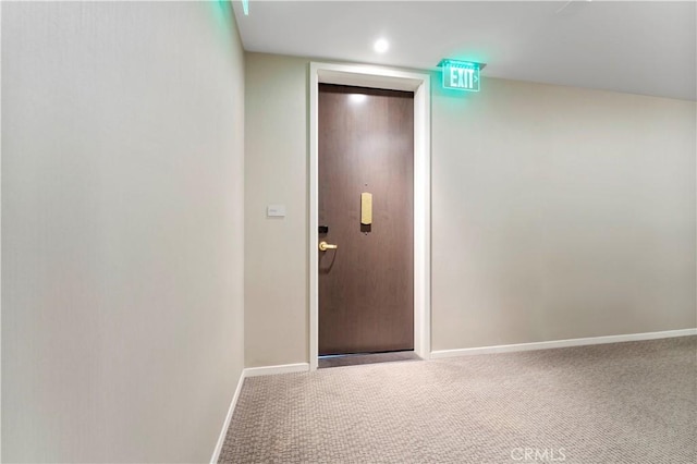 hallway with carpet floors