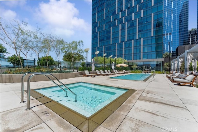 view of swimming pool with a patio