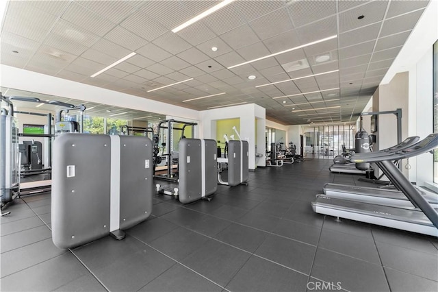 gym featuring a drop ceiling