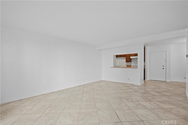 empty room with light tile patterned flooring