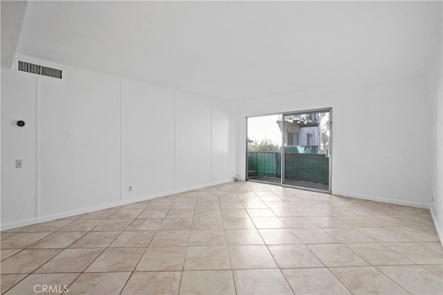 empty room featuring light tile patterned floors