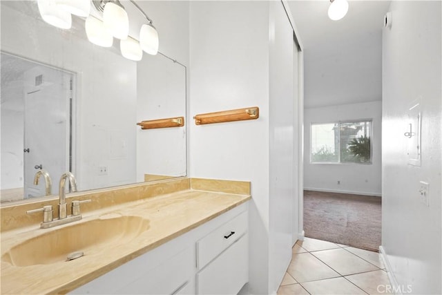 bathroom with tile patterned floors and vanity