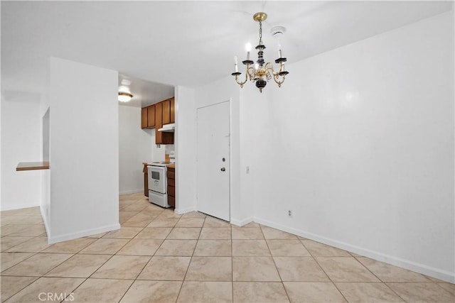 unfurnished dining area with light tile patterned floors and an inviting chandelier