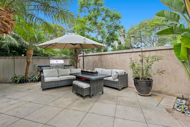 view of patio / terrace with a grill, outdoor lounge area, and exterior kitchen