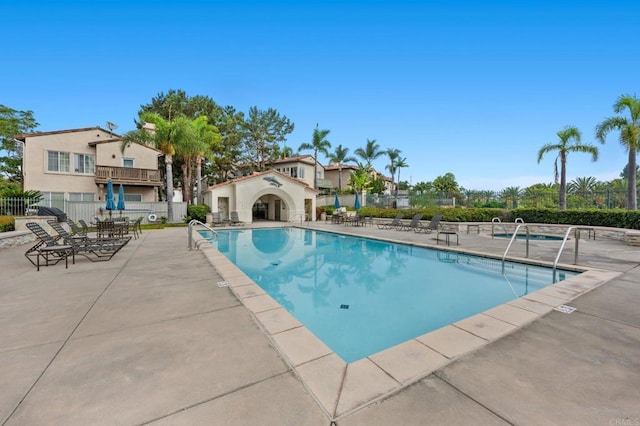 view of swimming pool with a patio area