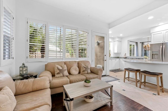 living room with plenty of natural light and a chandelier