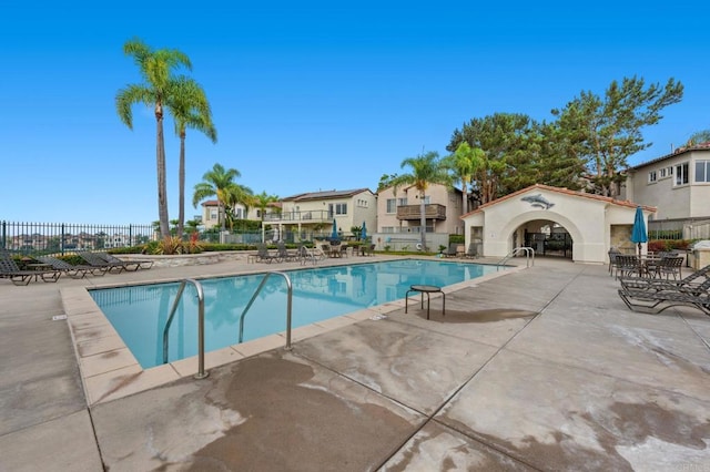 view of swimming pool with a patio