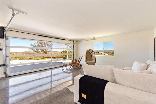 living room featuring concrete flooring